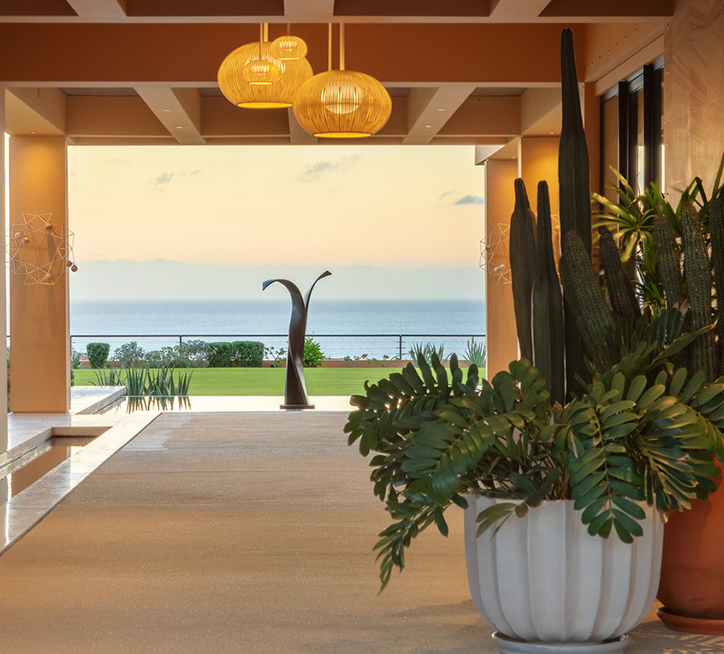 Twin Dolphin Los Cabos indoor/outdoor space at the clubhouse overlooking the ocean.