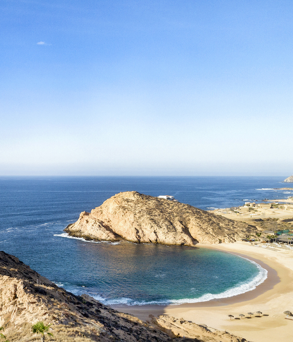 landscape image overlooking a sandy beach at twin dolphin los cabos in mexico